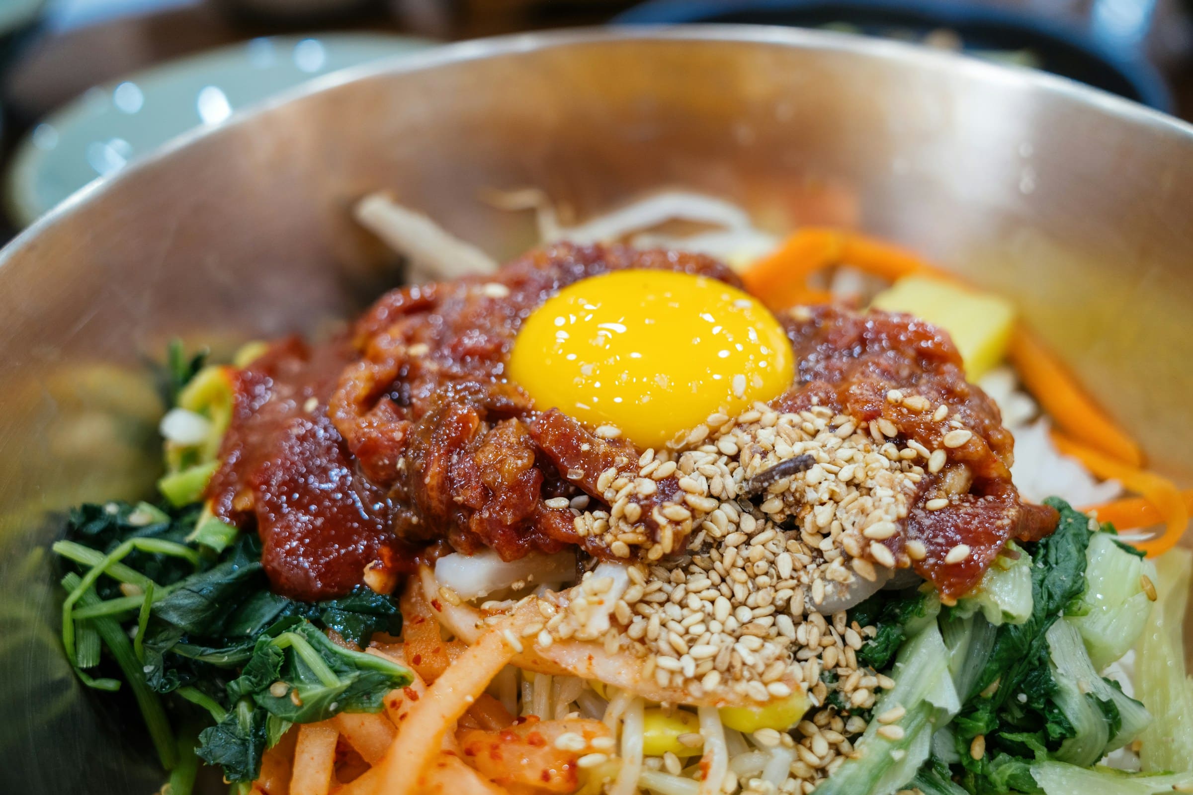 Bibimbap with fresh vegetables and egg yolk