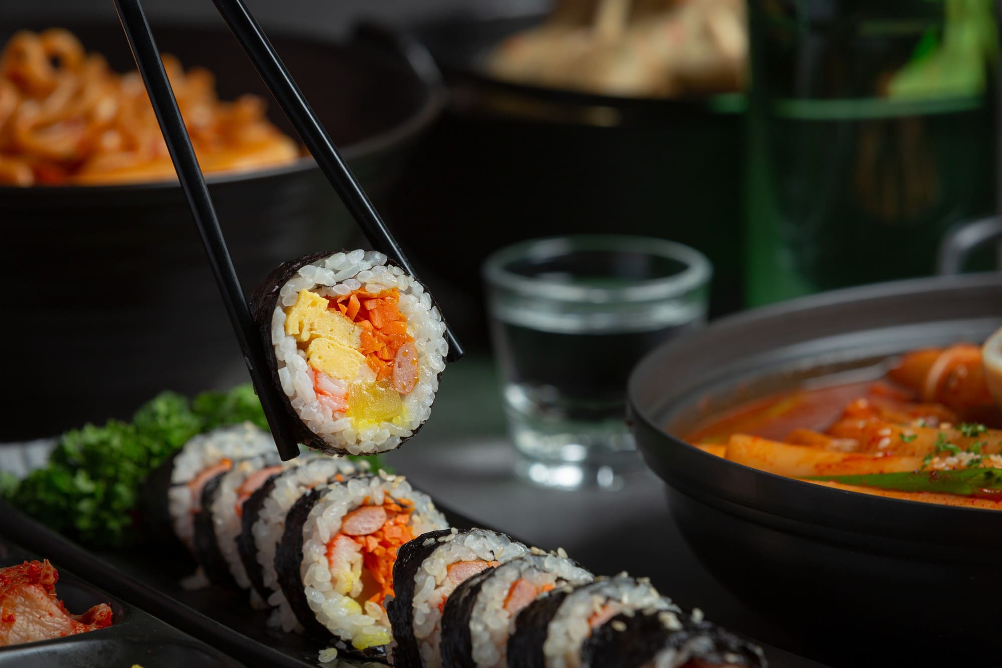 Korean Kimbap with rice, vegetables, and egg wrapped in seaweed.
